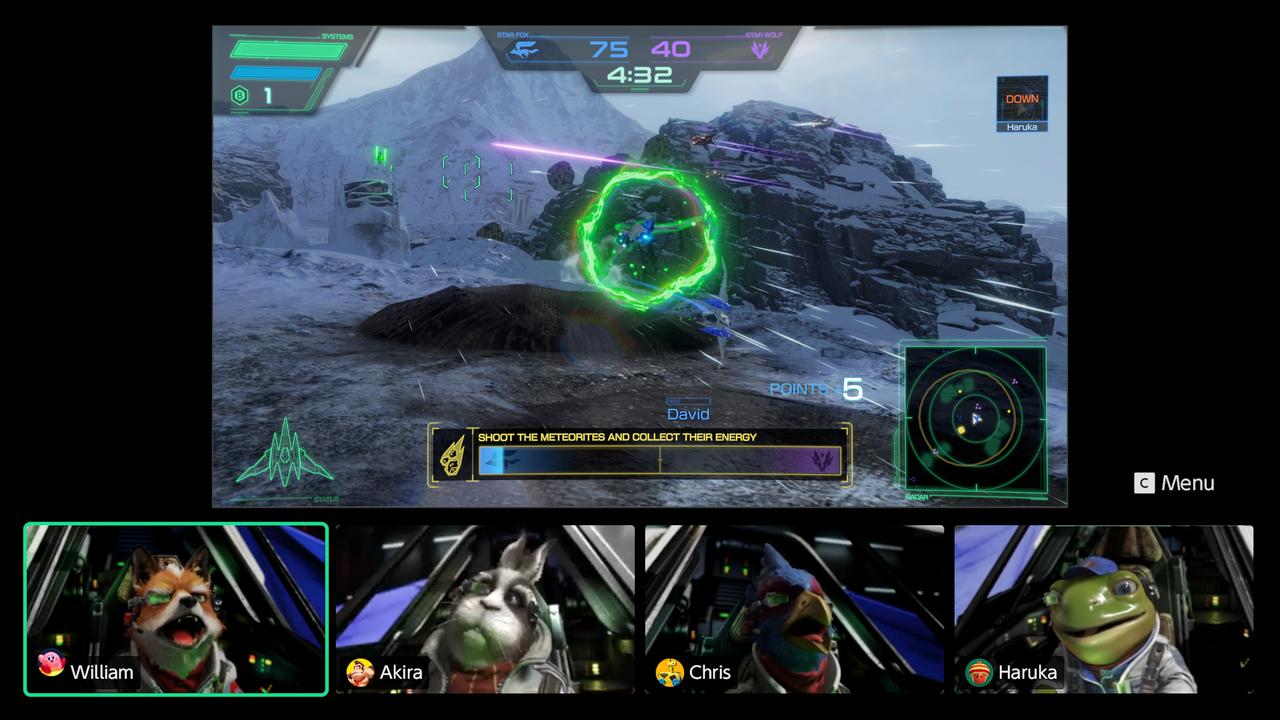 Star Fox gameplay showing a multiplayer match with player video panels for Fox, Peppy, Falco, and Slippy along the bottom of the screen.