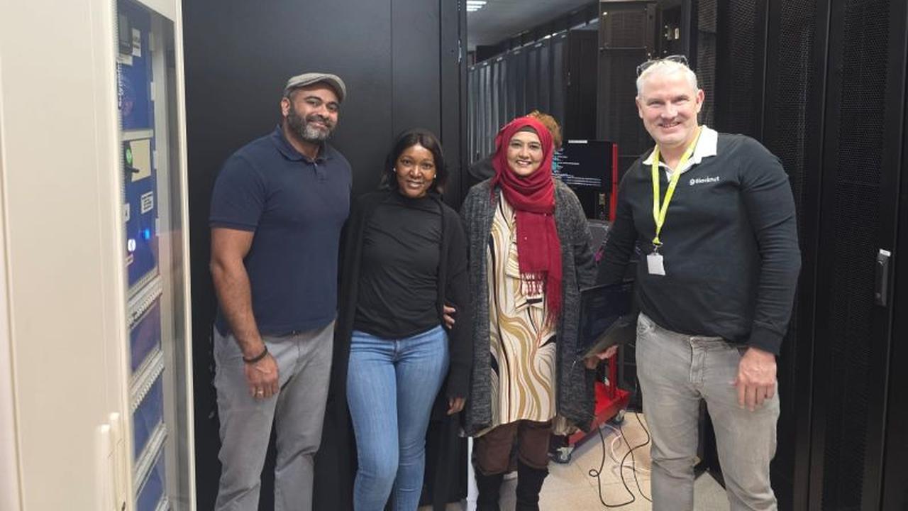 Vodacom Business and Blacknut Gaming representatives inside a South African data centre.