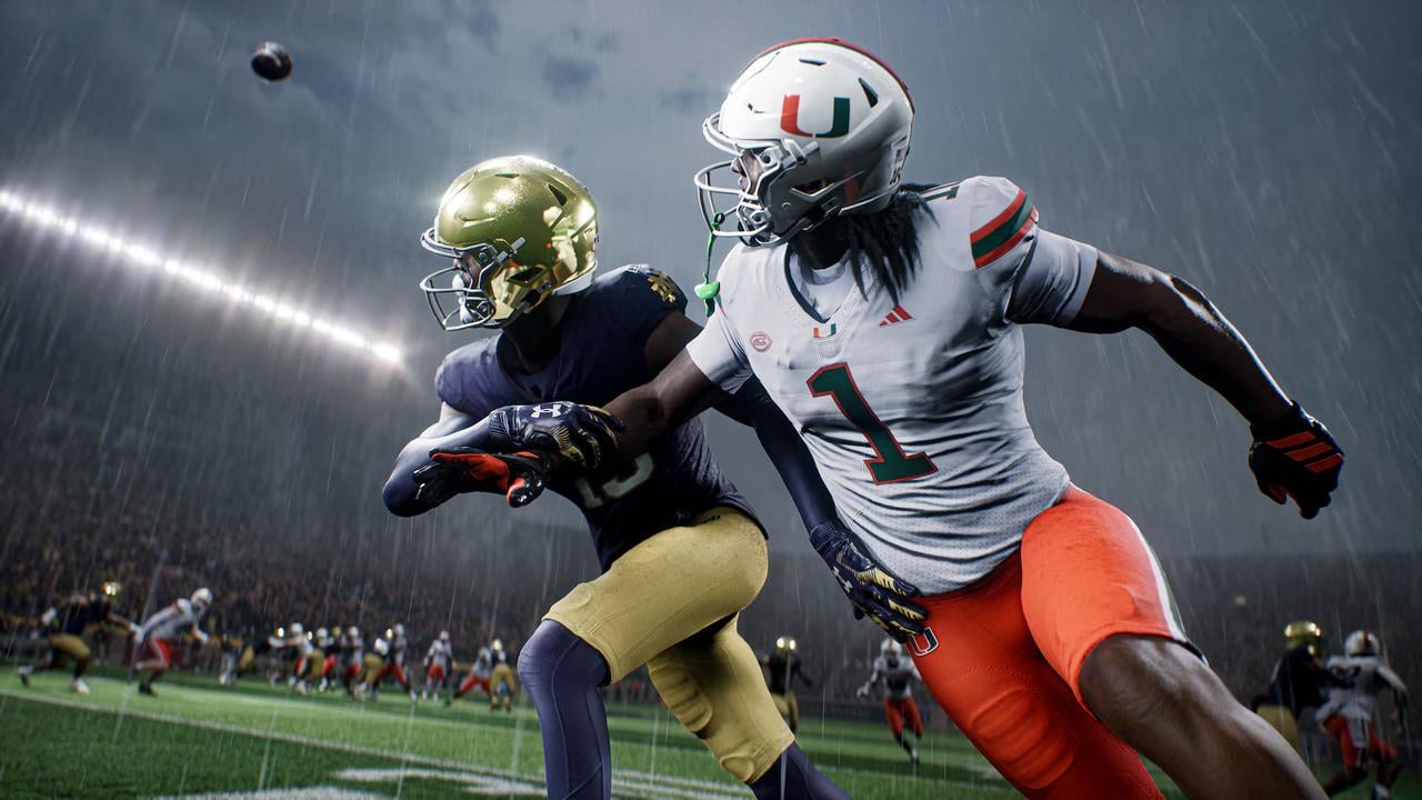 Miami and Notre Dame athletes battle for position during a rainy game in EA SPORTS College Football 27.