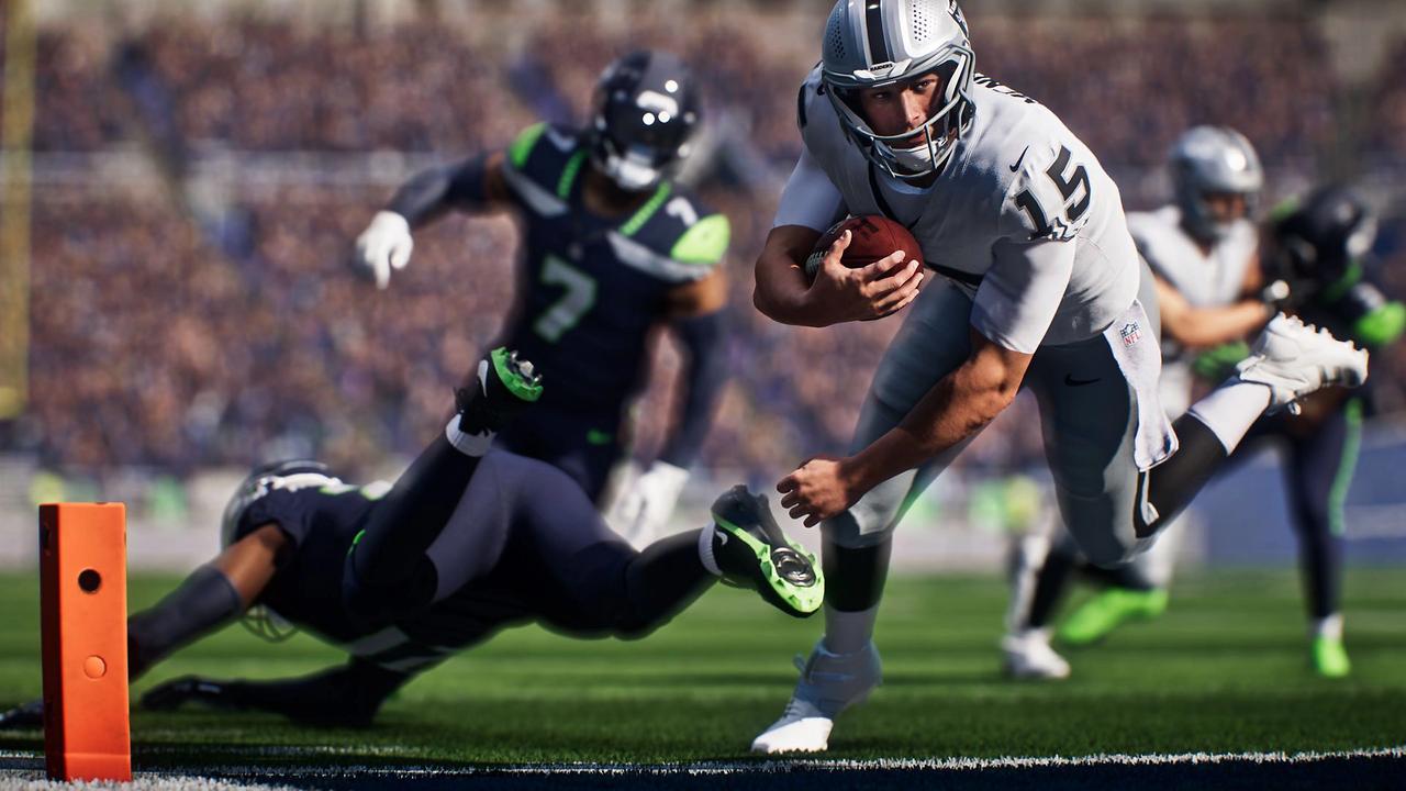 Madden NFL 27 gameplay showing a Las Vegas Raiders ball carrier diving toward the end zone against Seattle Seahawks defenders.